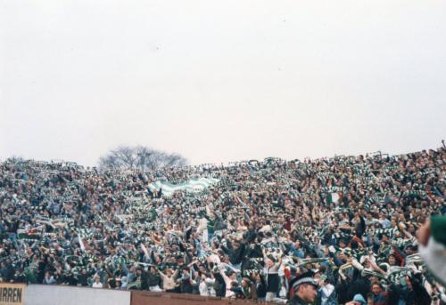 Fans celebrate behind Jim Stewart