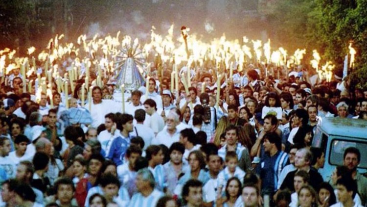 Racing fans and priests holy statue march to exorcism 1998